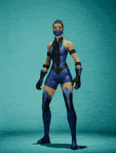 a woman in a blue costume is holding a pair of blue fans