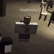 a roblox character with a crown on his head is standing in a dark room with chairs .
