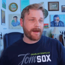 a man is wearing a shirt that says charlottesville tom sox