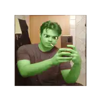 a man with green hair is taking a selfie