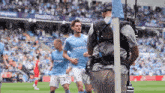 a soccer player wearing a jersey that says monzo
