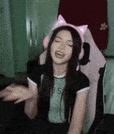 a woman wearing headphones and a shirt that says 35