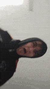 a close up of a person making a funny face with their tongue out