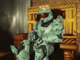 a video game character is sitting on a throne with a crown on their head
