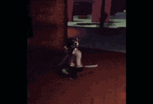 a person is flying through the air while holding a stick .
