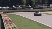 a race car is driving down a track with the number 22 on the side