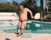 a man in swim trunks is jumping into a pool .