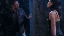 a man and a woman are standing next to each other and the man is asking the woman what the hell was that for