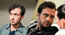 two men are sitting next to each other and one of them is looking at the camera