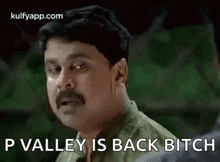 a man with a mustache is making a funny face and says p valley is back bitch .