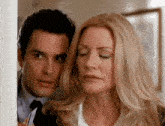 a man and a woman with their eyes closed