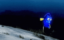 a blue fish with big eyes is swimming in the water