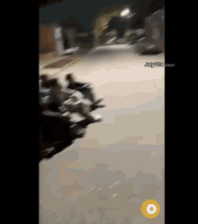 a group of people are riding motorcycles down a street with julyvgo.net at the bottom of the screen