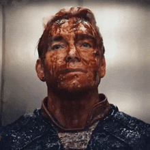 a man with blood on his face looking up