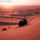 sanda media shows a desert landscape with a truck driving through it