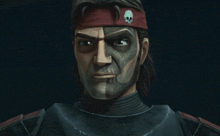 a close up of a man with a skull on his headband .