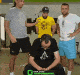 a group of men are standing in front of a sign that says kick.com/jeanpormanove
