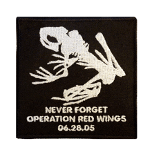 a black patch that says never forget operation red wings