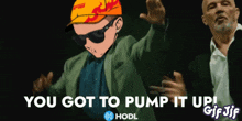 a gif of a man in a suit dancing with the words you got to pump it up