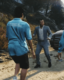 a man in a blue shirt that says the tracy is written