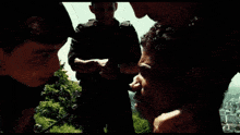 a man is talking to a police officer while another man stands behind him