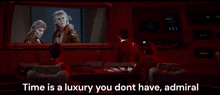 a group of people are sitting in front of a screen with the words time is a luxury you dont have admiral
