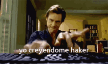 a man is typing on a keyboard and the words yo creyendome hacker are above him