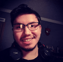 a man wearing glasses and headphones with the letter hx on them