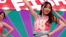 a cheerleader with the number 48 on her shirt