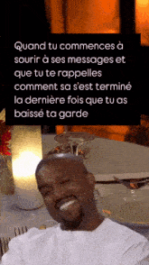 a picture of a man sitting at a table with a caption that says quand tu commences