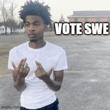 a young man in a white shirt is giving the middle finger in a parking lot with the words vote swe behind him