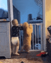 a baby and a dog are standing next to each other