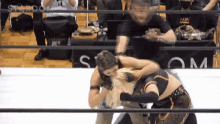 two women are wrestling in a ring with the word stardom on the bottom