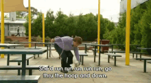 a woman is running with a hula hoop and the words she 'd run run run run go thru the hoop and down are visible