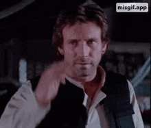 a man in a star wars costume has a misgif.app icon on the bottom of his screen