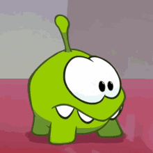a green cartoon character with a long tail and big eyes