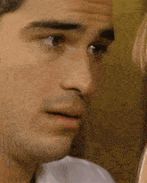 a close up of a woman 's face with her eyes closed