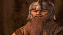 a bearded man wearing a helmet and holding a sword with the words and my axe below him