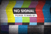 a sign that says no signal please stand by on a tv screen
