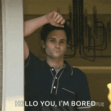 a man in a blue shirt says hello you i 'm bored flix