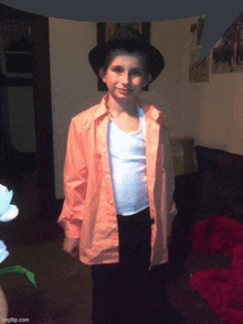 a young boy dressed in a michael jackson outfit