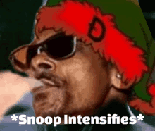 snoop dogg is wearing sunglasses and a red hat with the letter d on it