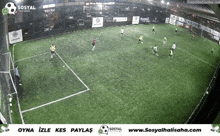 a soccer game is being played on a field that is sponsored by sosyal