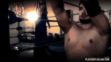 a shirtless man in a boxing ring with the website playedbyjulian.com in the bottom right corner