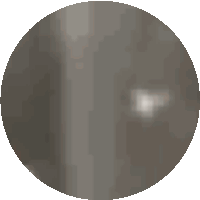 a pixelated image of a circle with a few white dots on it