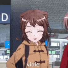 a close up of a girl in a brown coat with the word viole on it .