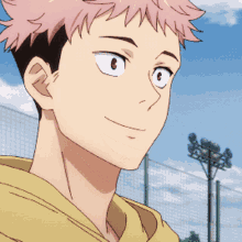 a close up of a boy with pink hair and a yellow hoodie