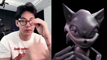 a man wearing glasses and a picture of a cartoon cat .