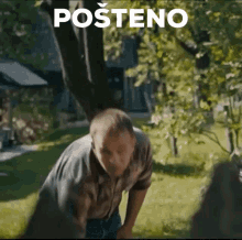 a man is standing in the grass with the word posteno written above him