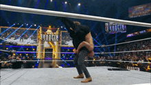 a wrestling ring with a sign that says " dynasty " on it